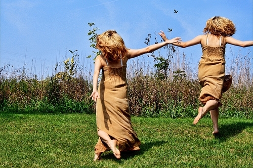 girls running in field