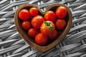 Gray basket with red tomatoes